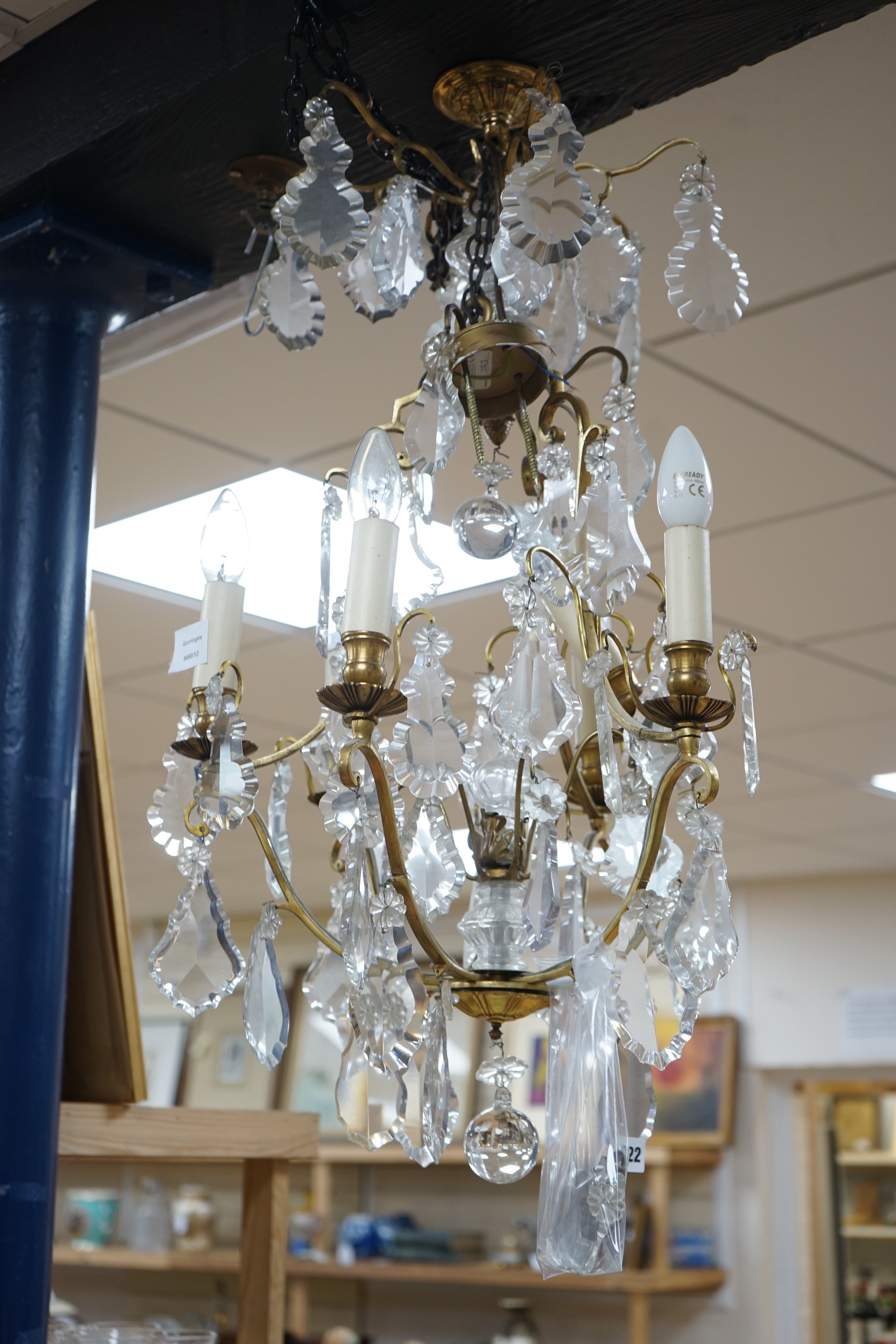 A late 19th/early 20th century French ormolu and lustre hung chandelier, drop approximately 70cm